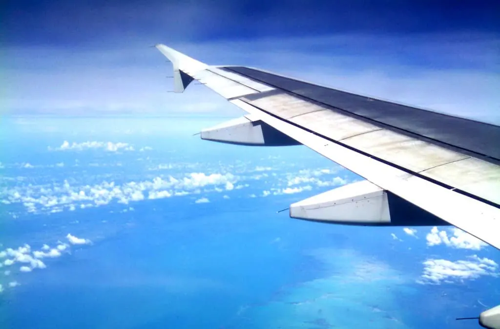 Airplane flying with sunset background